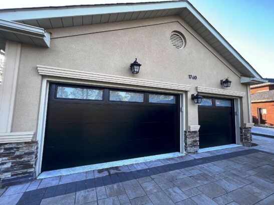 Modern Black Garage Door Installation | Barrie, ON | ADR Garage Door Modern black insulated garage door installation completed by ADR Garage Door at a residential home in Barrie, Ontario.