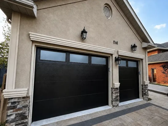 Black Insulated Garage Door Installation in Barrie Black insulated garage doors installed at a Barrie, Ontario home by ADR Garage Door
