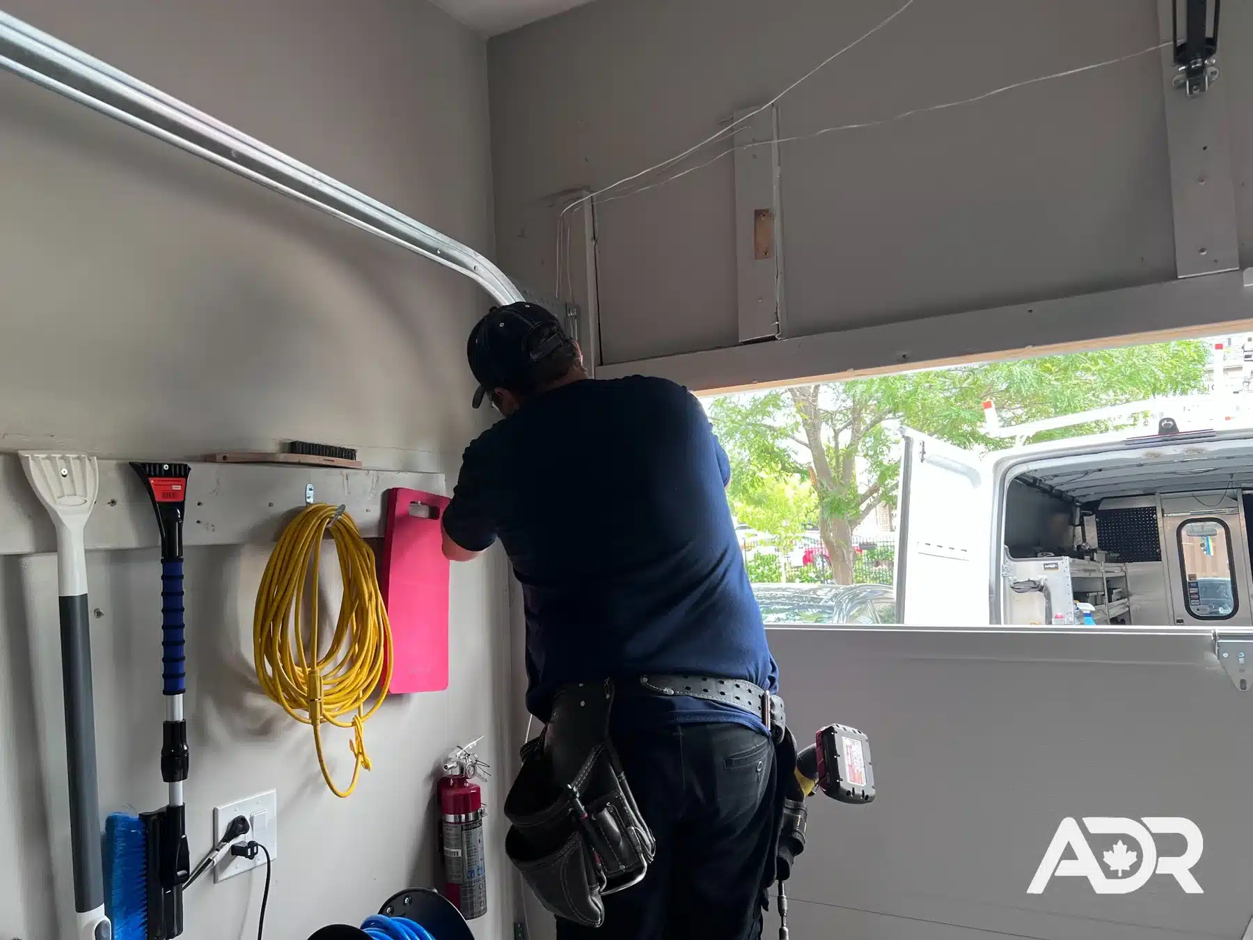 ADR technician repairing a residential garage door