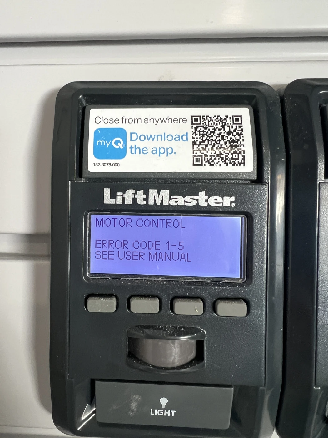 LiftMaster wall control displaying Motor Control, Error Code 1-5 and See User Manual.